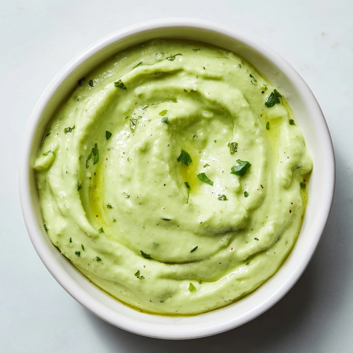 Creamy Avocado Lime Dressing: A bright green, velvety pourable dressing, ideal for drizzling over your favorite salads.