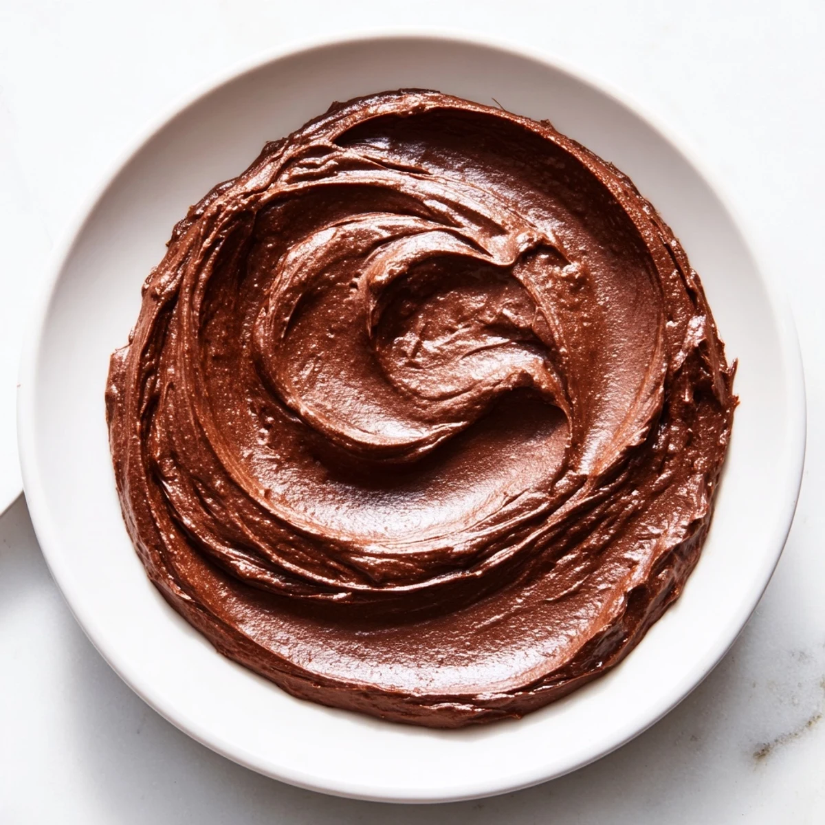 This creamy chocolate spread is swirled in a jar, ready for waffles.
