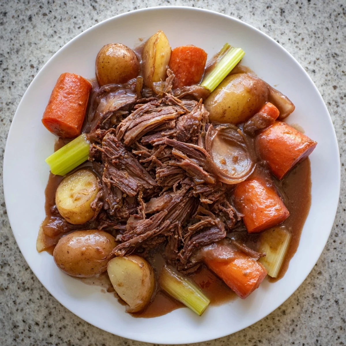 Fork-tender slow cooked pot roast, fall-apart beef with tender vegetables in a rich gravy.
