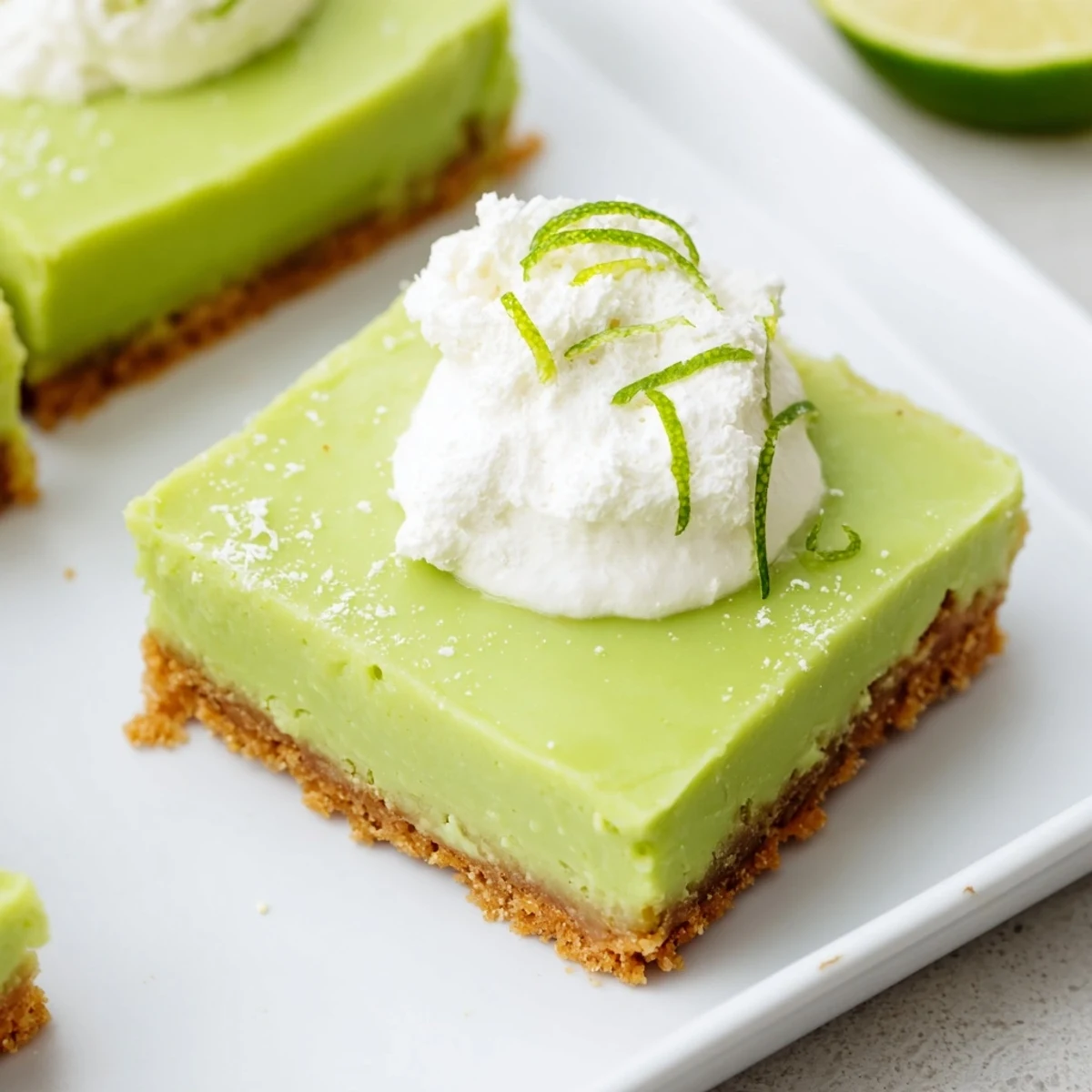 Freshly chilled St. Patrick's Day Key Lime Pie Bars with a vibrant green filling, ready to serve at a festive party.