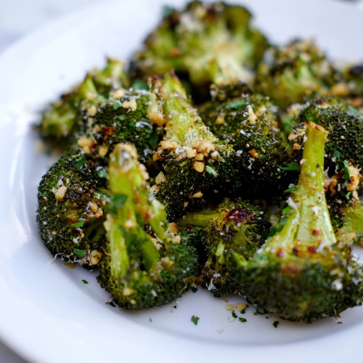 Garlic roasted broccoli with melted Parmesan and lemon wedges for a bright finish.