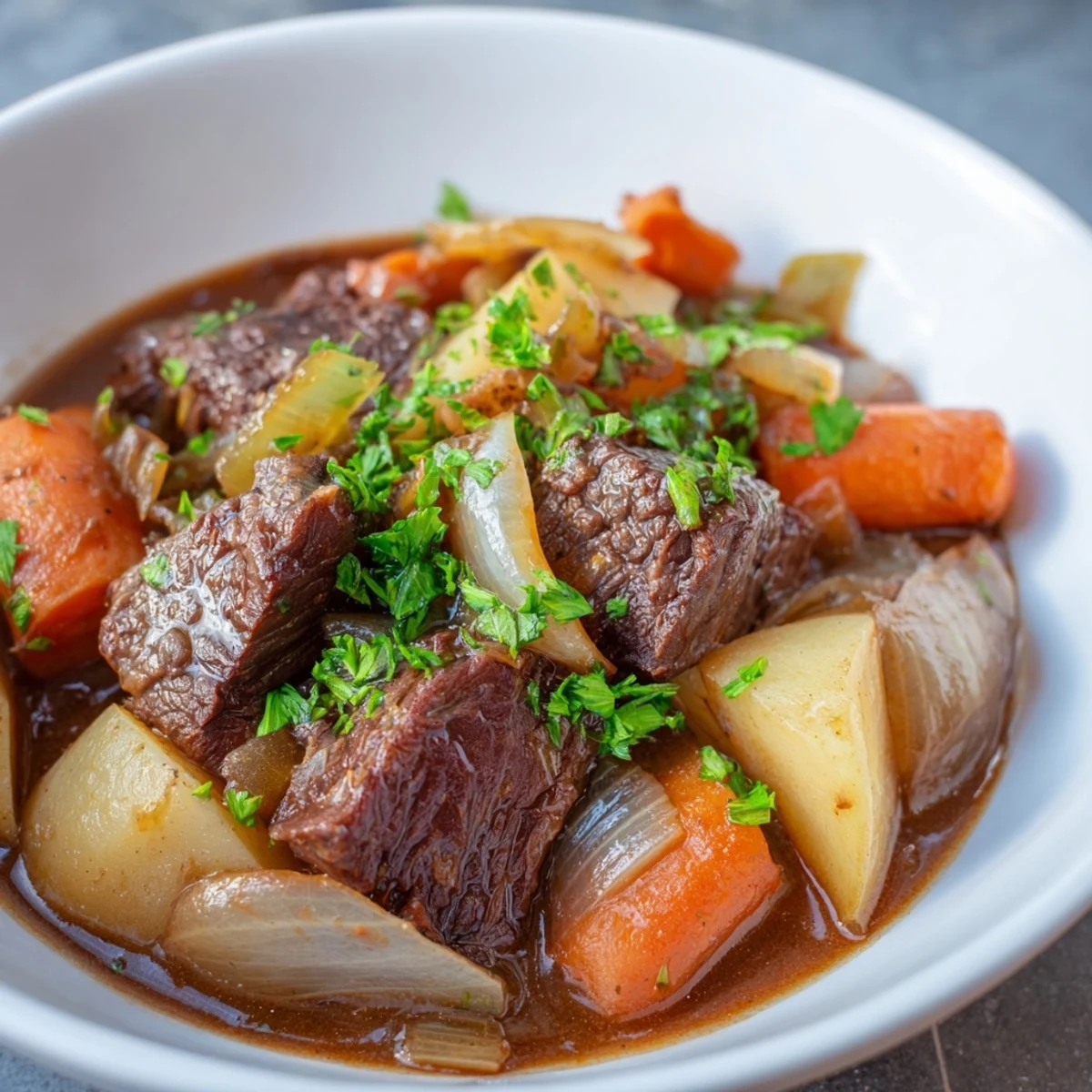 This hearty Irish Beef and Vegetable Stew features carrots and potatoes in a savory gravy.