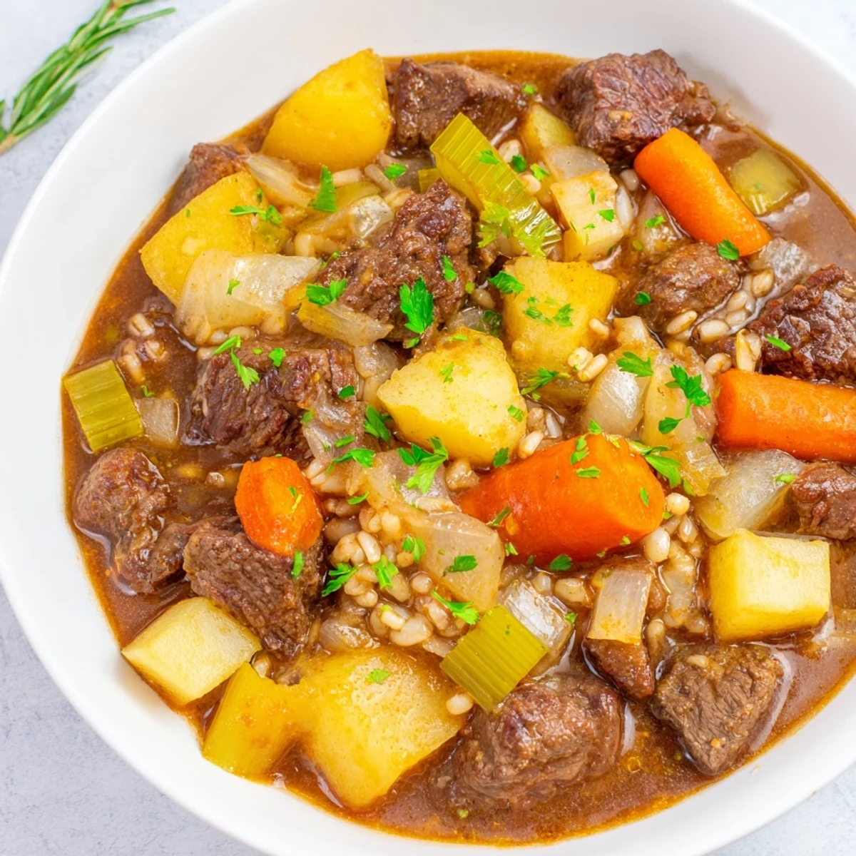 Hearty Irish Beef and Vegetable Stew with Barley served in a rustic bowl, showcasing tender beef and root vegetables.