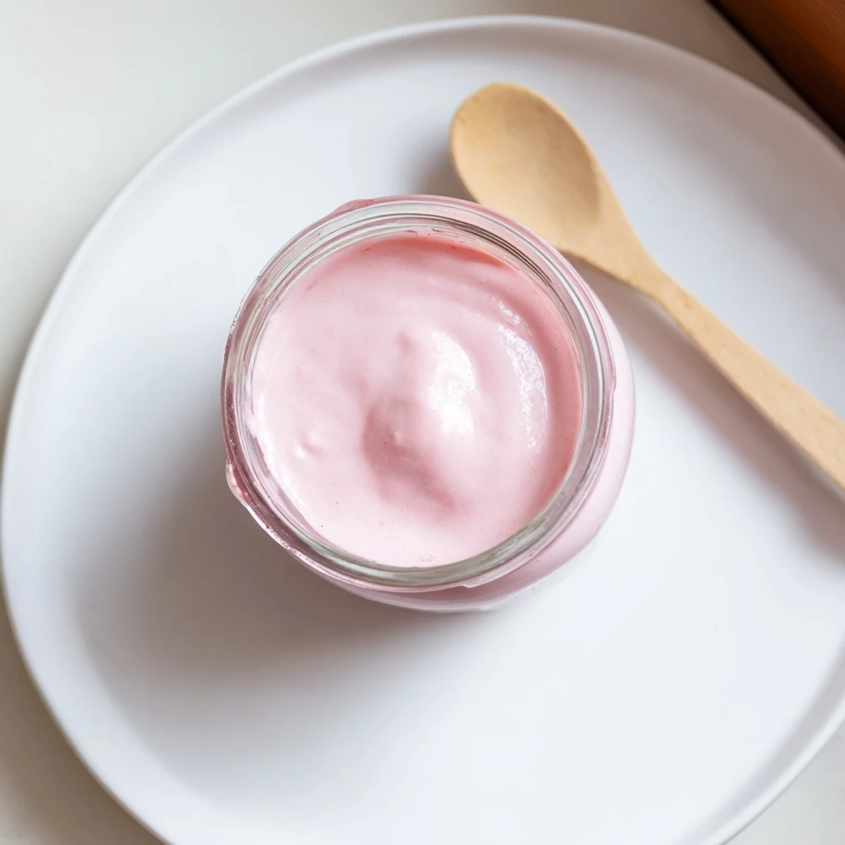 Silky homemade pink lemon curd swirl showing tangy texture and beautiful blush color