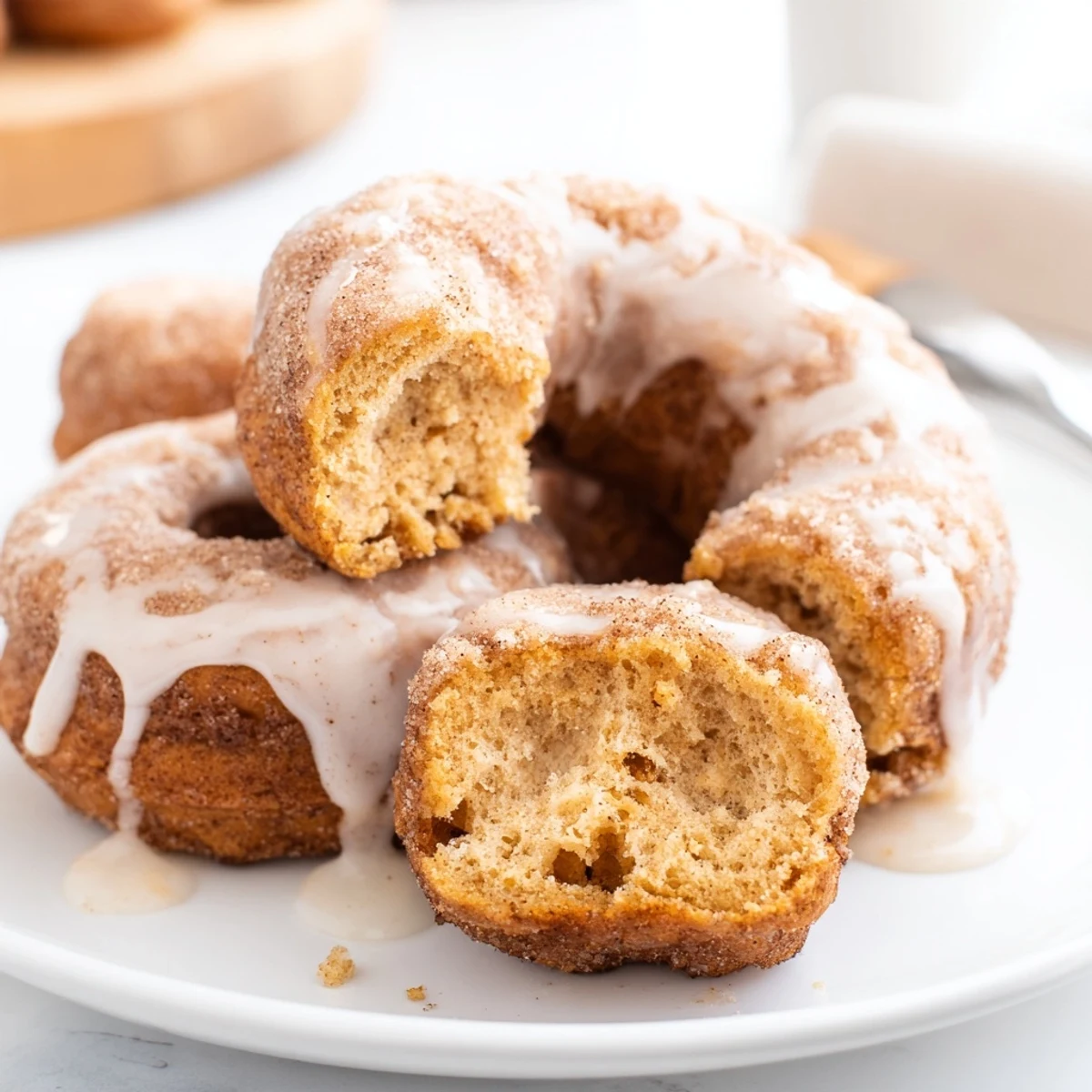 Soft fried donuts filled with spiced pumpkin and topped with sweet white icing