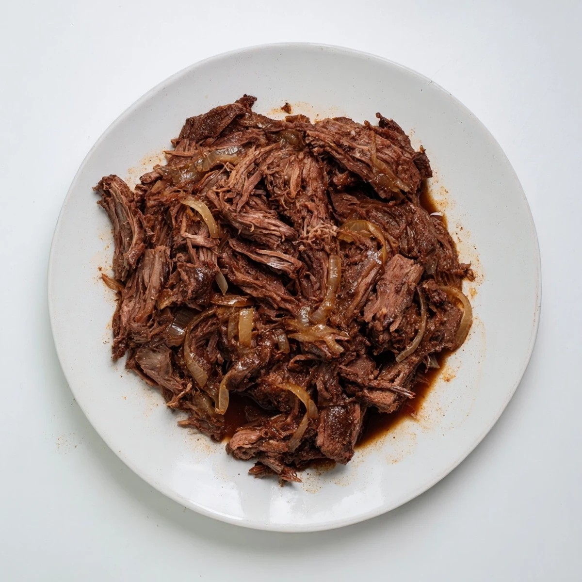 Golden brown Crock Pot shredded beef perfect for tacos, sandwiches, or rice bowls