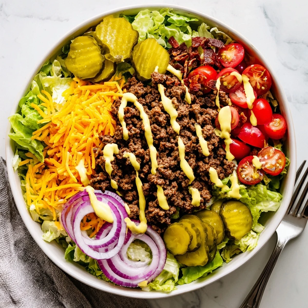 Golden brown ground beef piled over crisp lettuce with melted cheddar and special sauce in these low-carb burger bowls