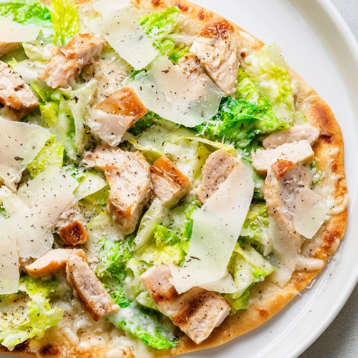 Crispy flatbread loaded with juicy chicken, crisp romaine lettuce and creamy Caesar dressing