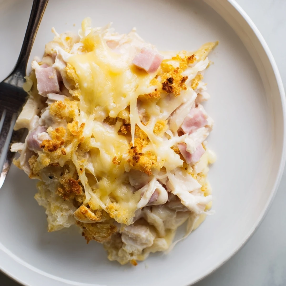 Steaming, bubbly Chicken Cordon Bleu Casserole with crispy Panko breadcrumb topping