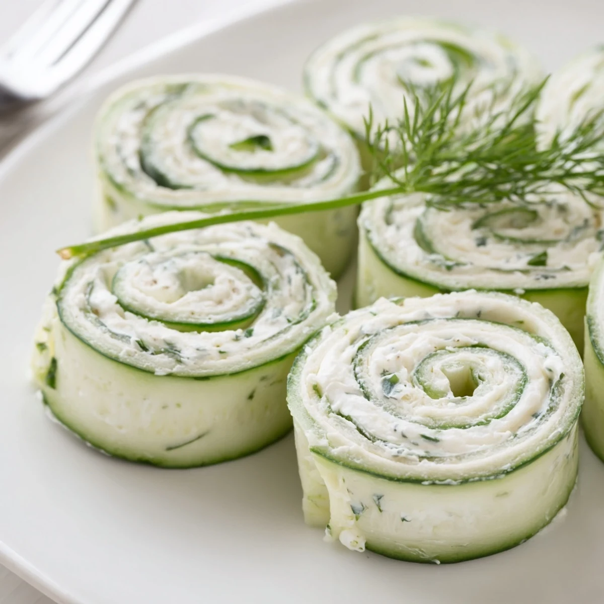 Tray of Cucumber And Dill Pinwheels, soft tortillas rolled, refreshing bite
