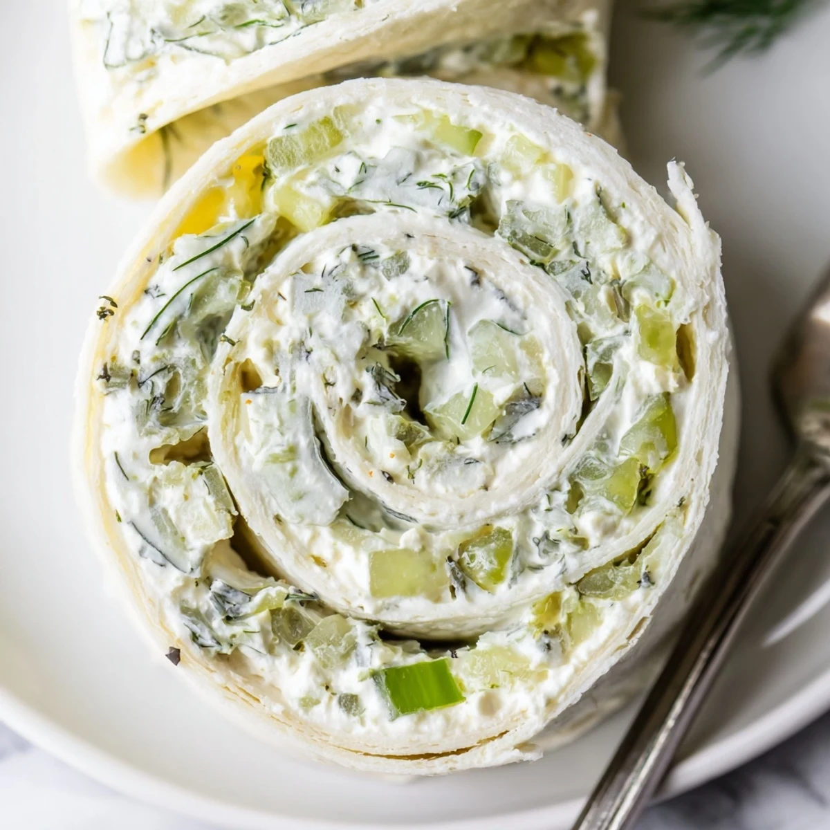 Pickle Dip Pinwheels served with toothpicks, bright green dill garnish.