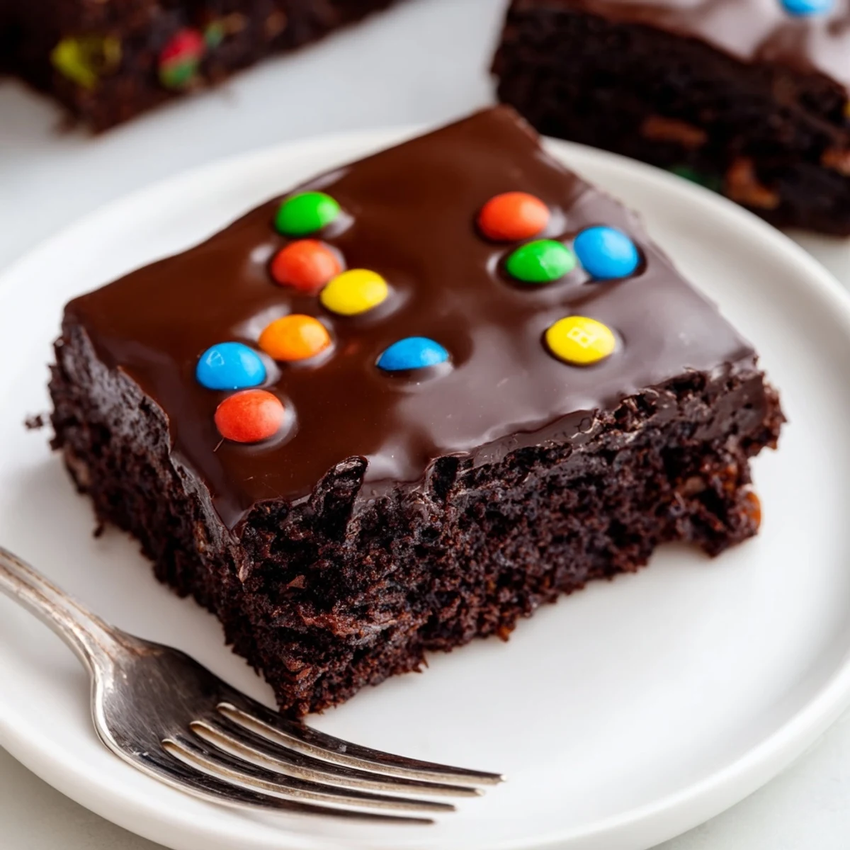 Gourmet Cosmic Brownies Bars with glossy chocolate ganache and rainbow candy topping