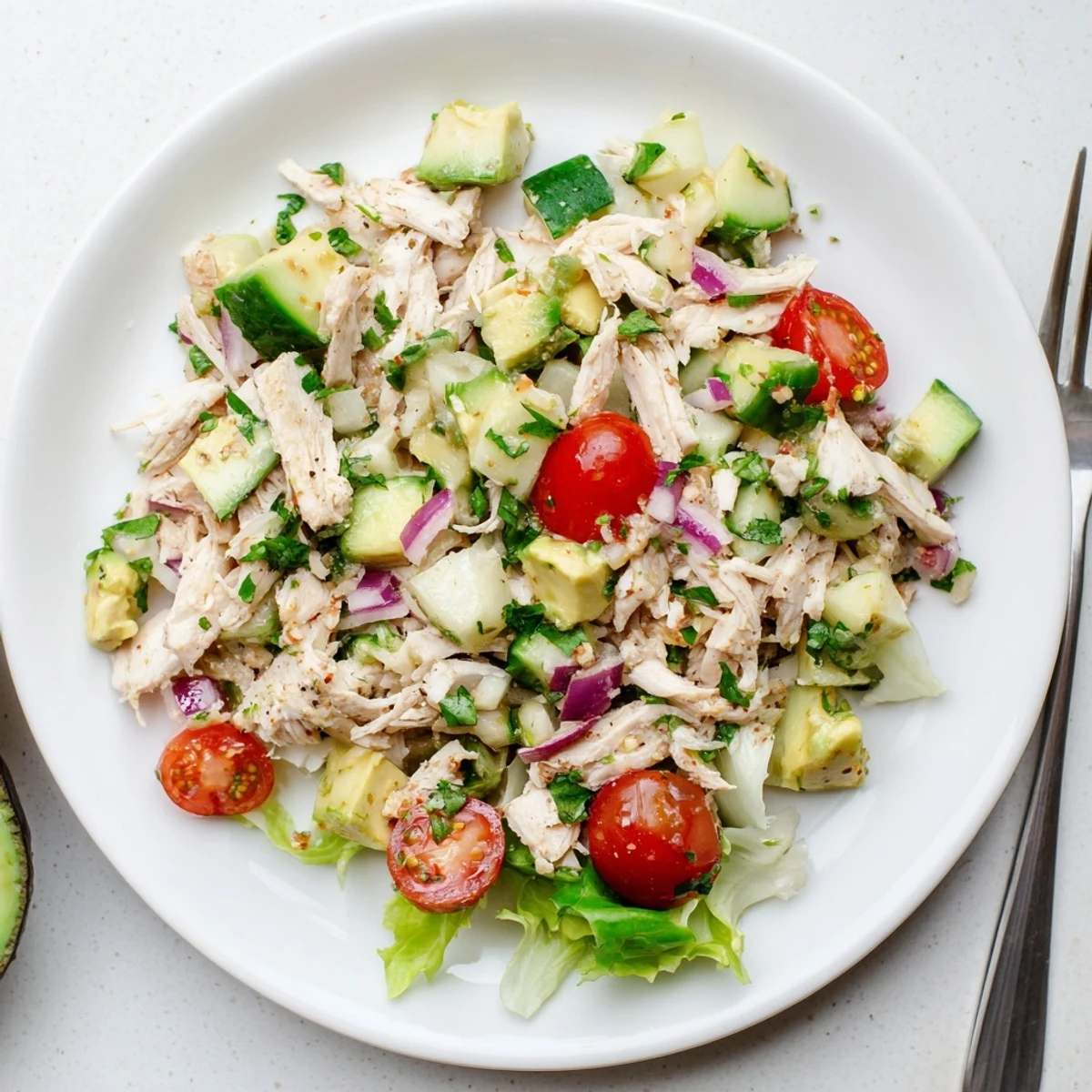 Creamy Avocado Chicken Salad with ripe avocado, cherry tomatoes, and cilantro