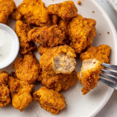Buttermilk marinated Chicken Bites with crunchy crust, served with tangy ranch