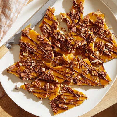 Crunchy pecan pie bark topped with buttery caramel and toasted nut pieces
