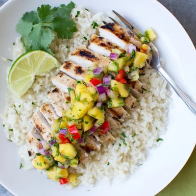 Tropical Dinner Delight served over fluffy coconut rice with fresh lime wedges